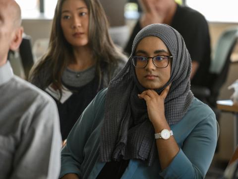 Students listening from their seats in a classroom 
