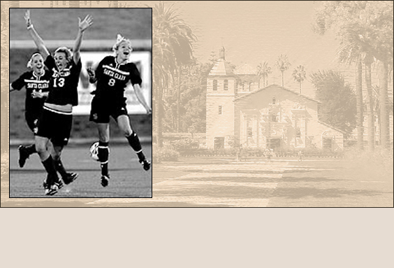Two women playing soccer; faded background of a building and trees.