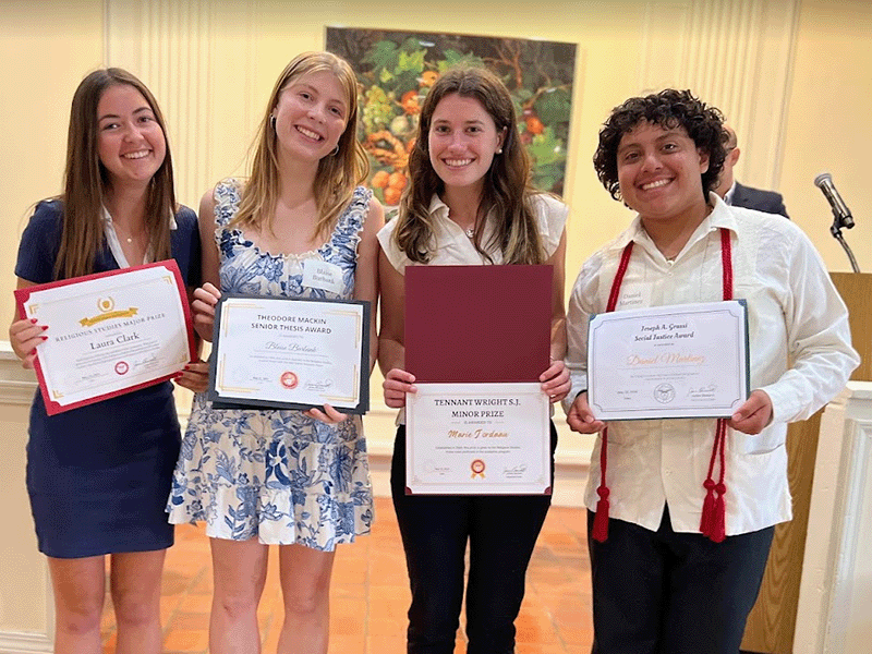 Students with their awards in the Adobe Lodge