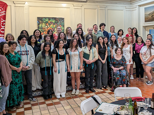 Faculty and Student group photo in the Adobe Lodge