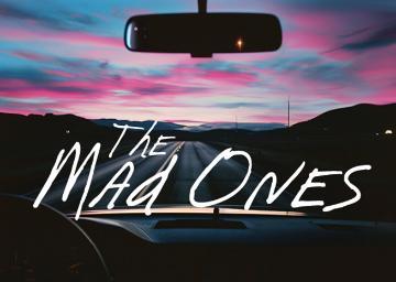 Sunset seen through a car windshield with text 