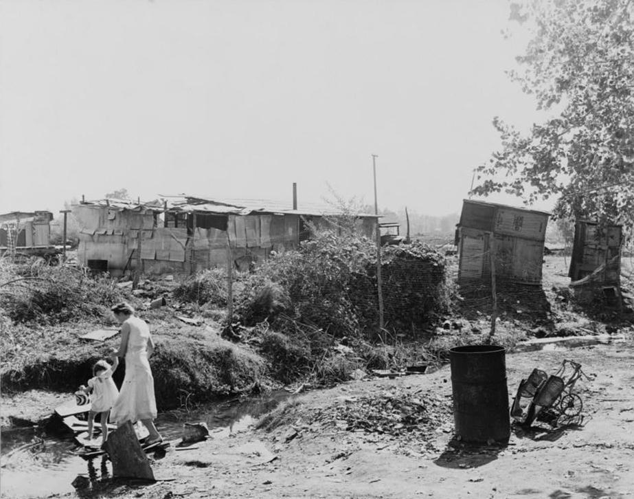 Woman and her young daughter in a squatter camp during the Great Depression.