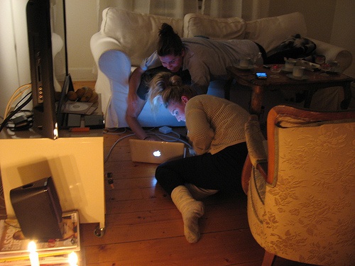 young women looking at a laptop computer