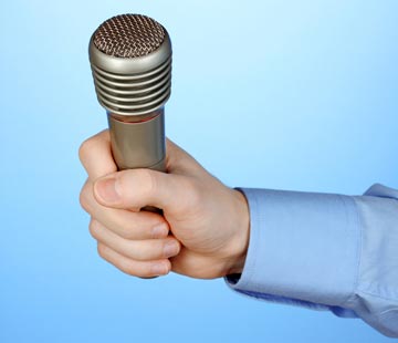Hand holding a microphone