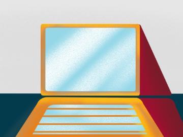 A laptop on a table. 