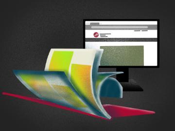 A magazine and a monitor displaying the Markkula Center website. 