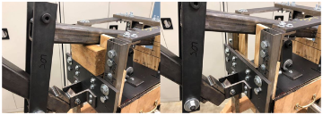 The simple wooden block stop implemented to keep the input lever from falling or trapping extremities when not in use.