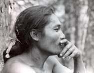 A person in profile, resting their chin on their hand.