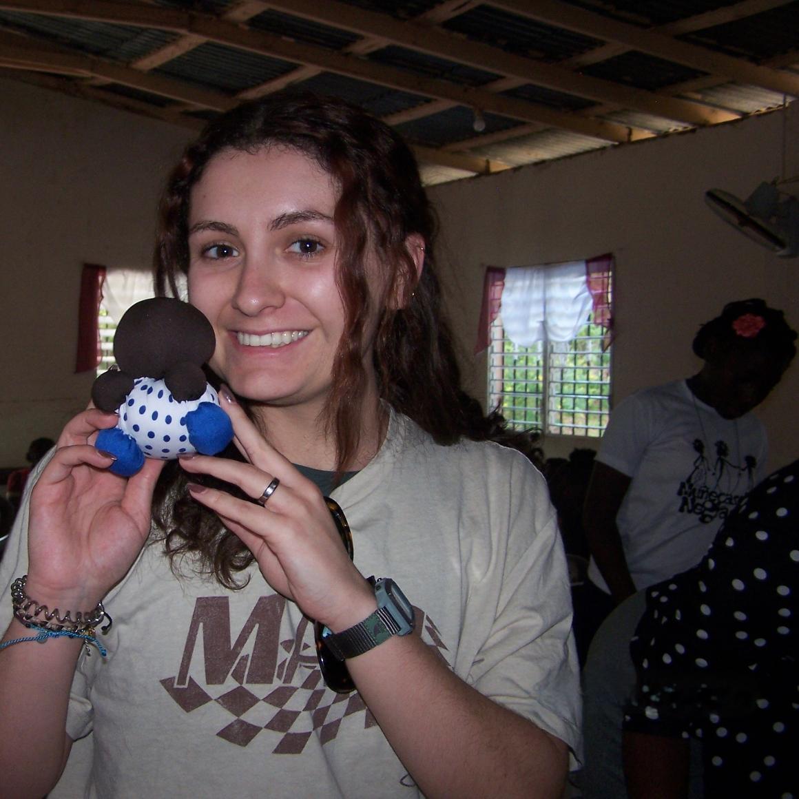 Megan Milligan with a little stuffed doll 