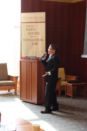 Person standing and speaking at 2016 Santa Clara Lecture next to a podium.