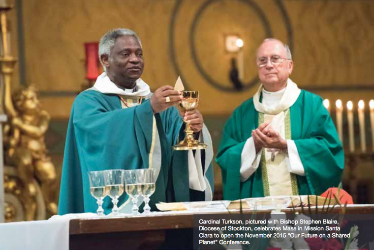 Two priests in green vestments performing a religious ceremony with chalices.