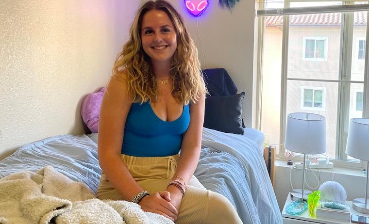 Charlie Johnson '26 in her dorm room at Casa Italiana Apartments.