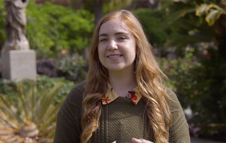 Woman student standing in Mission Gardens