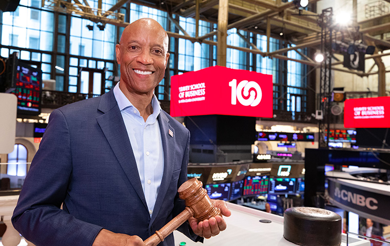Leavey School of Business Dean Ed Grier with gavel in hand at the New York Stock Exchange