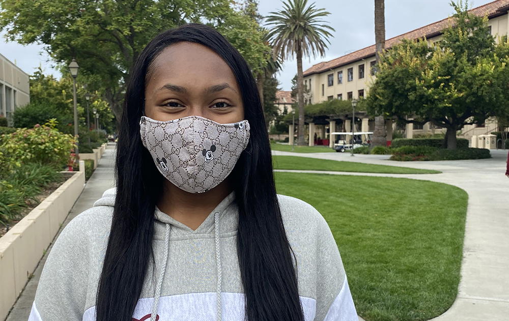 Hydeia Wysinger stands next to Benson Center