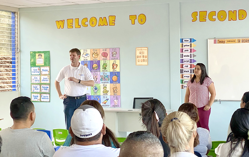 Joe Albers speaking in classroom with parents of second graders watching on.