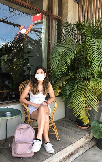 Hana Seastedt takes a break from her studies near her home in Laos.