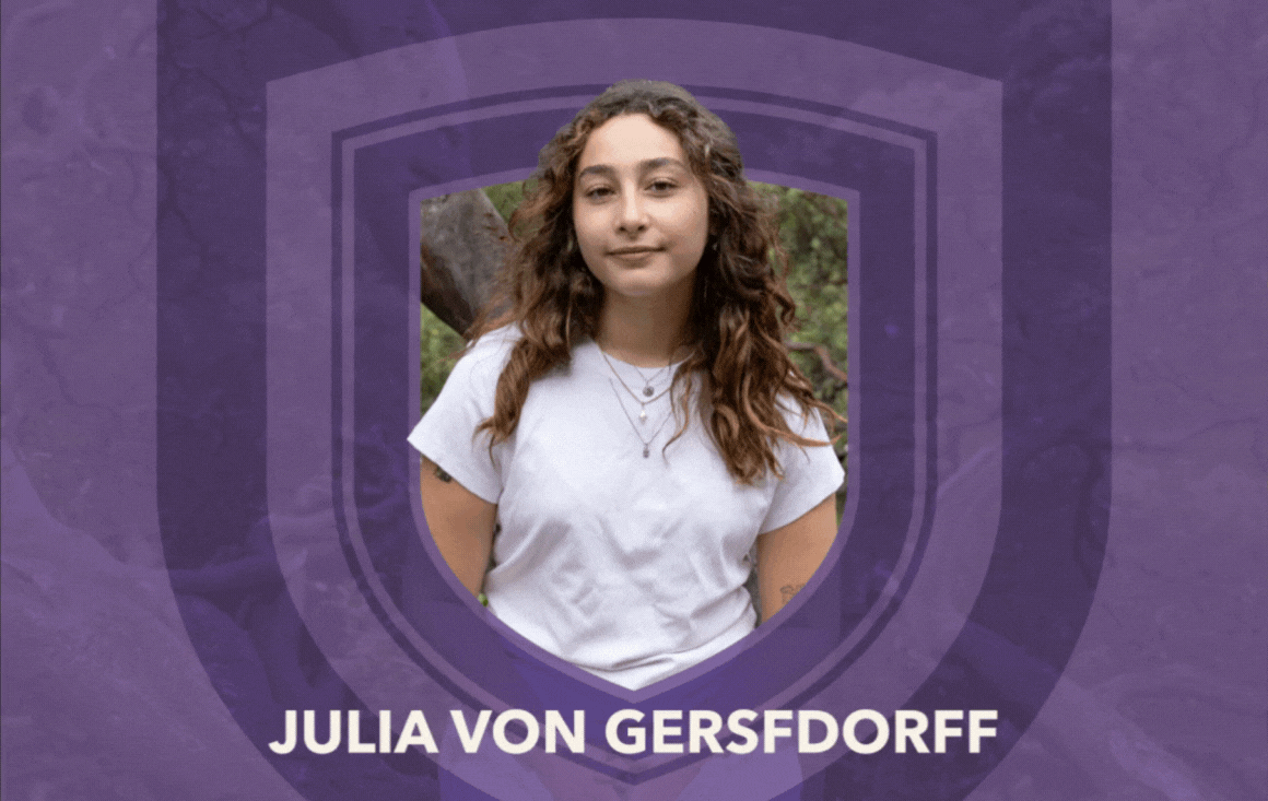 A gif of a purple shield moving around Julia von Gersdorff, who is standing in the forest