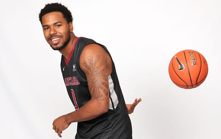 KJ Feagin passing the ball behind his back image link to story