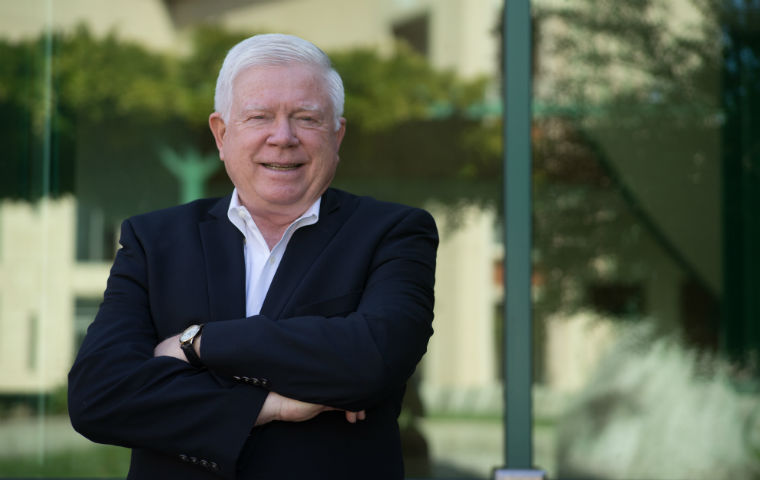 Photo of Markkula E.D. Kirk Hanson outside with arms crossed