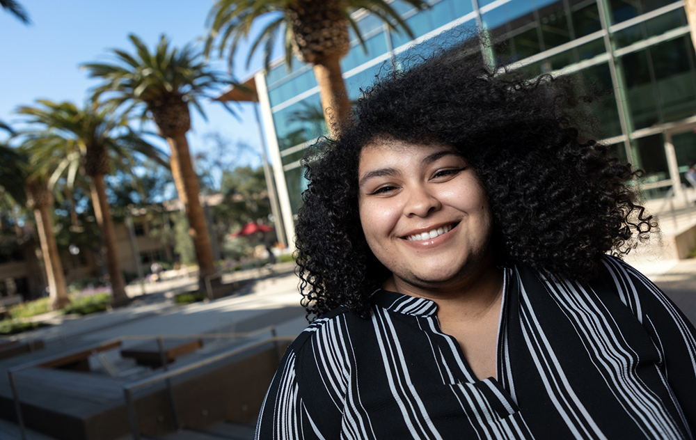 Rachel Stattion stands in the Sobrato courtyard outside of SCDI image link to story