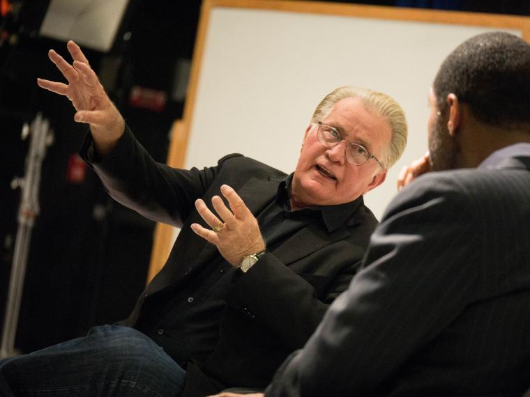 Martin Sheen speaking animatedly while seated across from another person. image link to story