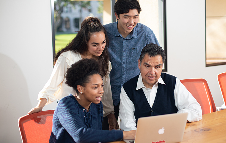 De Novo Fellows Rene Harper ’20, Noel Del Toro ’21, and Dylan Lawton ’20, with biology professor Angel Islas, who helped start the De Novo Fellowship program. The funds enable STEM students from underrepresented groups to conduct research and attend industry conferences.