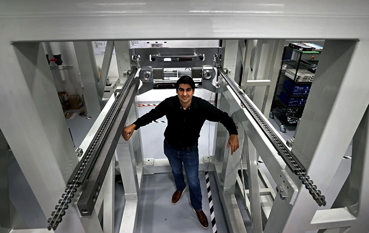 James DeMuth standing in walkway