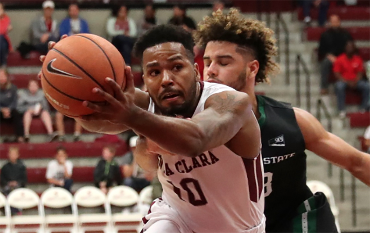 KJ Feagin drives to the basket