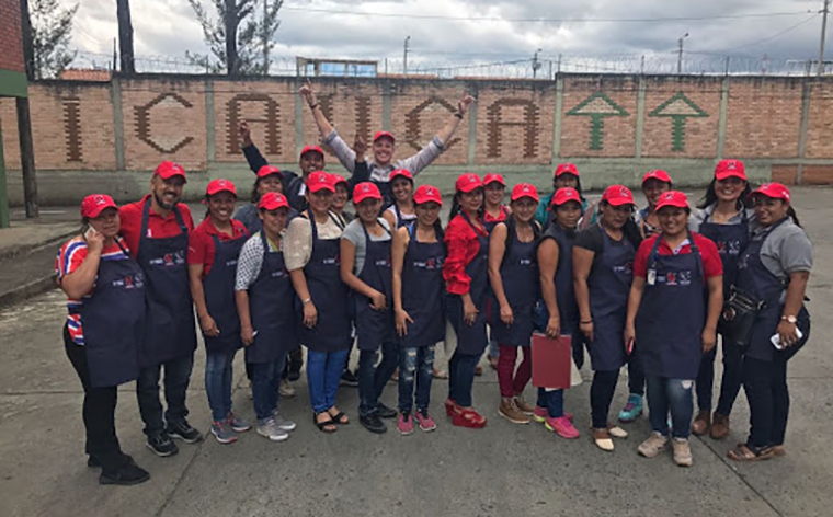 Group of people standing in front of wall