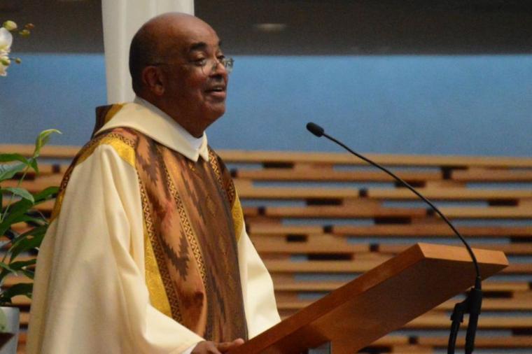Fr. Jay Matthews at the pulpit in the Oakland Cathedral image link to story