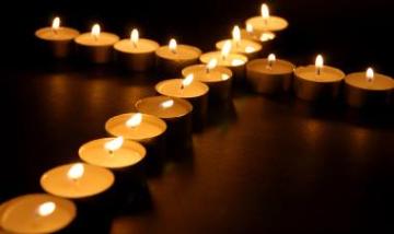 candles in shape of a cross