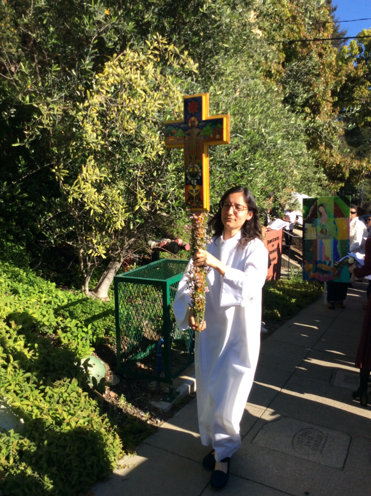 Silvana Arevalo carries processional cross for 30th Anniversary of Instituto Hispano