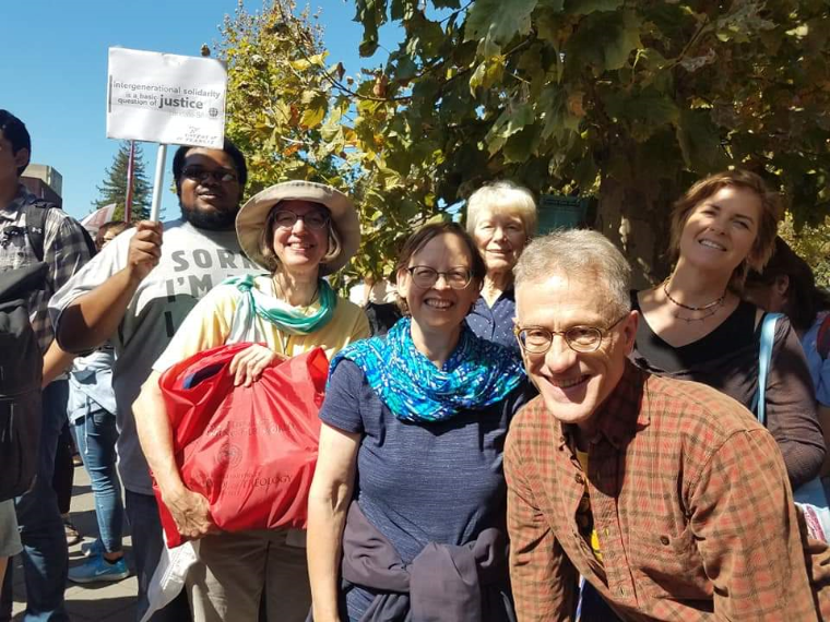 A group of people at a climate change strike at UC Berkeley.