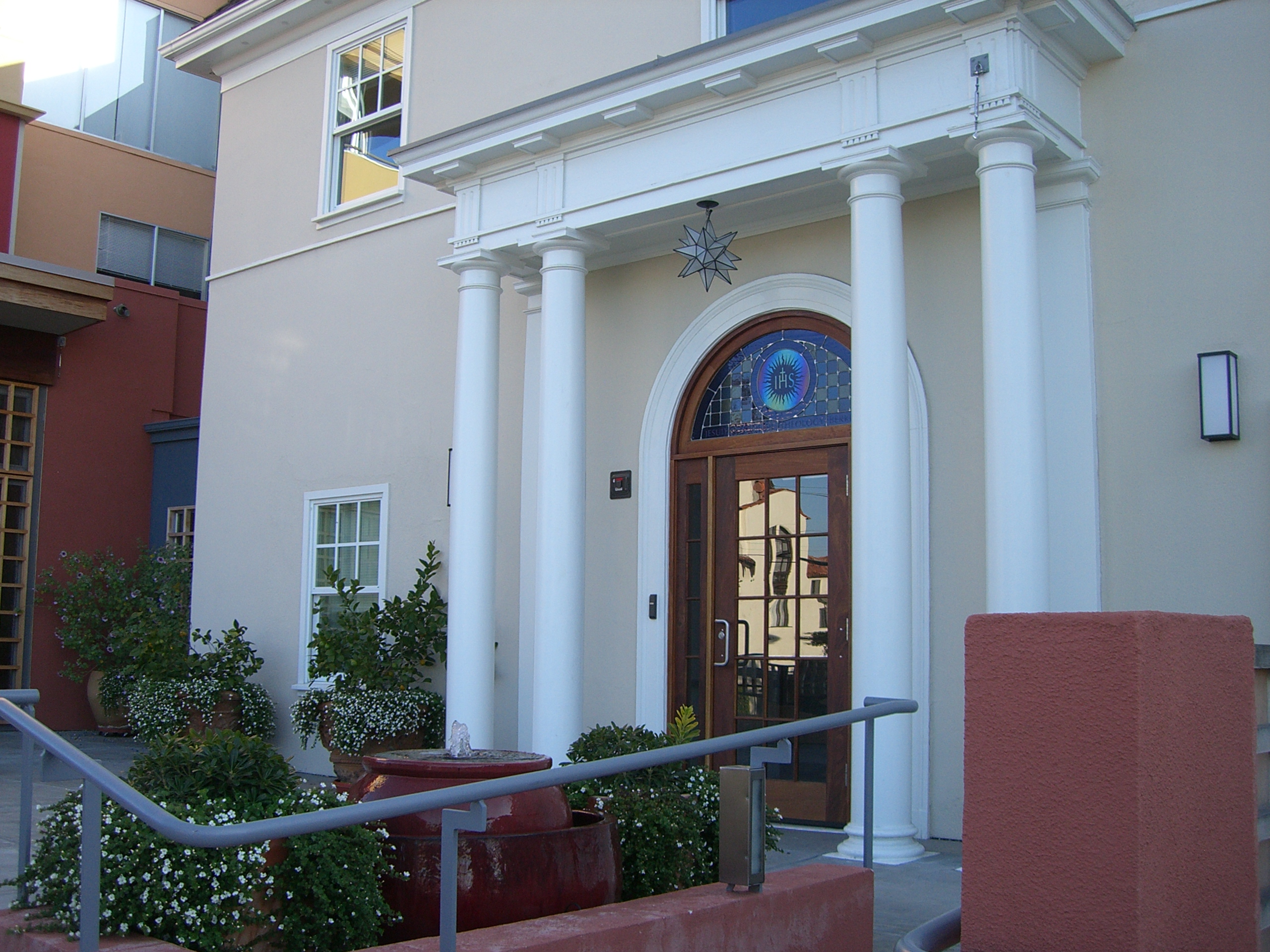 Entrance of JST Building with columns and ramp.