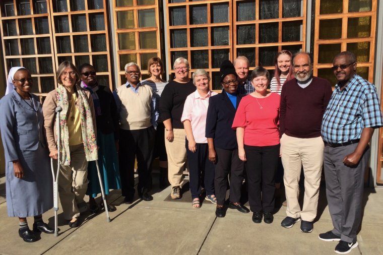 Group photo titled 'Renewal Cohort Fall 2019' with people standing outside a building.
