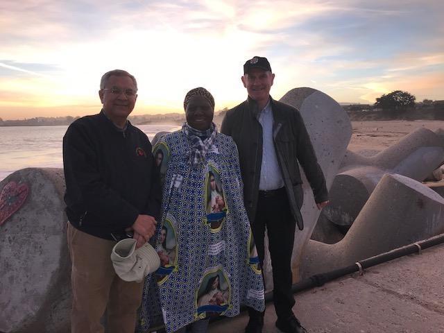 3 students standing outside