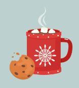 Red mug of hot cocoa with marshmallows and a cookie.