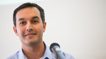 Man at table with mic 
