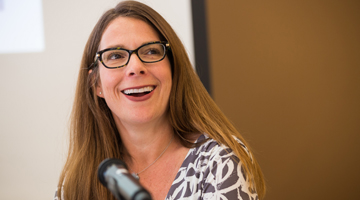 Emily Cervino at table with mic 