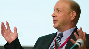 Guy at table with mic 