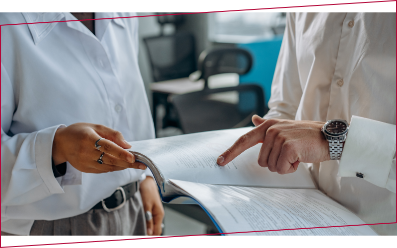 Person pointing out information to someone else