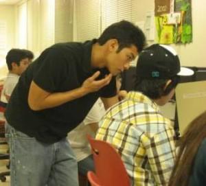 Two people interacting in a classroom setting on Oahu.