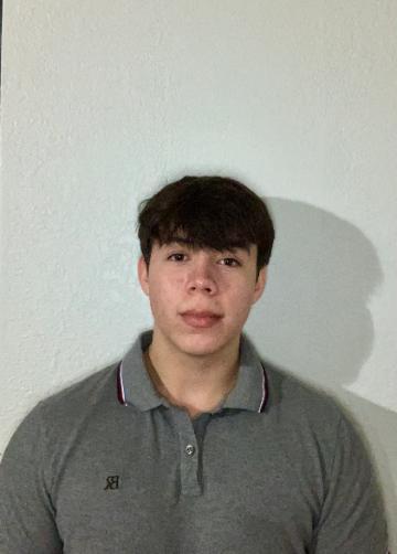 A person wearing a gray collared shirt against a plain white background.