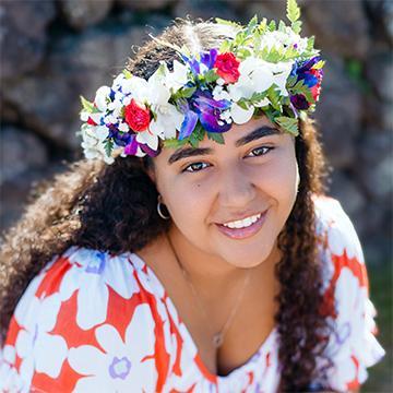 Woman smiling with flowered headdress