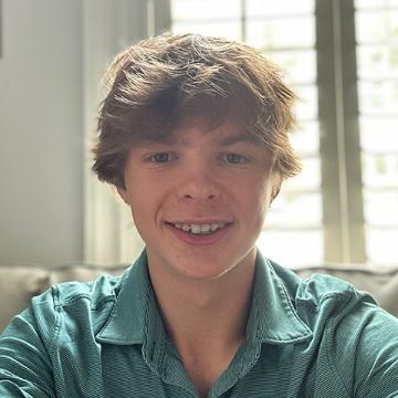 Man in green shirt smiling