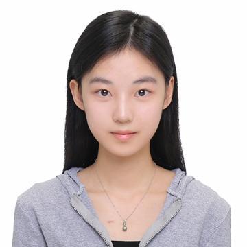 Woman smiling in gray hoodie