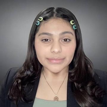 Woman in black jacket smiling