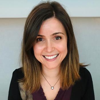 A woman smiling in a profile picture.