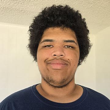 Man in black tshirt smiling